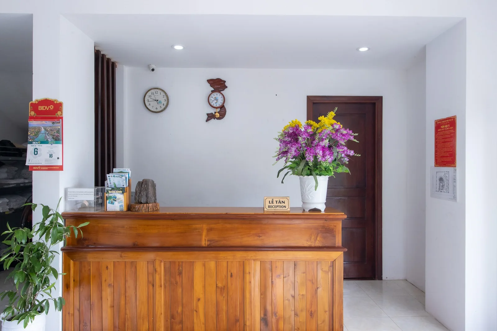 Reception counter of Hung Vuong Resort with flowers