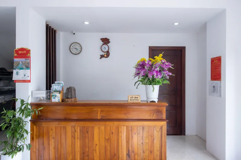 Reception counter of Hung Vuong Resort with flowers