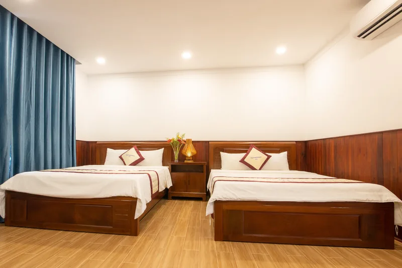 Two queen beds in the Deluxe Family Pool View