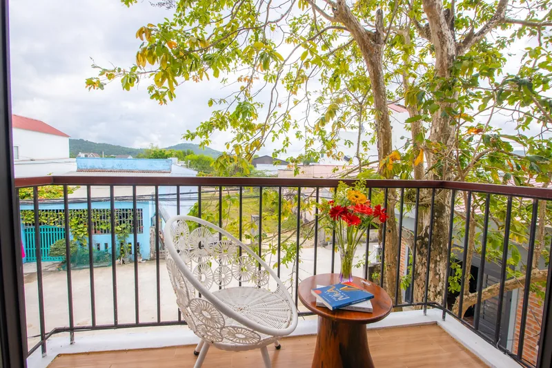 Balcony chair of a Deluxe Garden View room looking into the trees