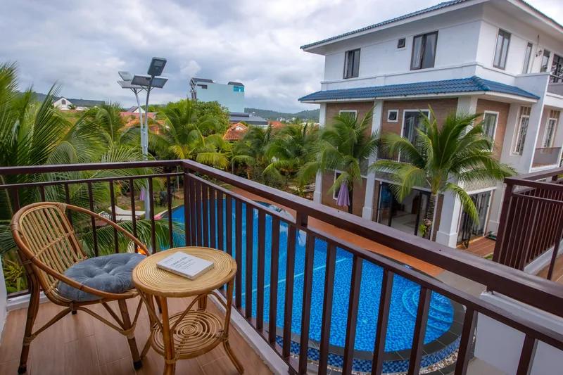 Balcony table looking across the pool to the next block