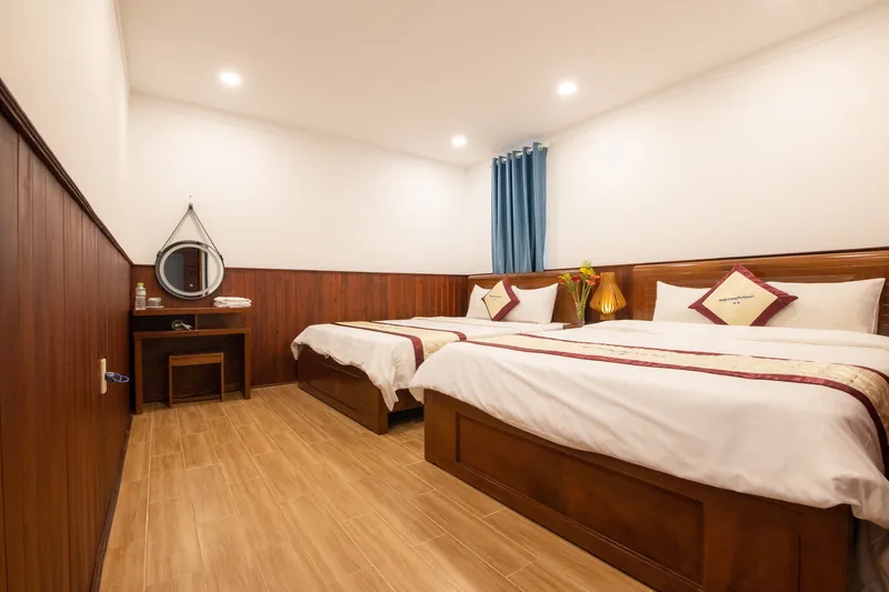 A Block C room with wood panelling, a dressing table and a mirror