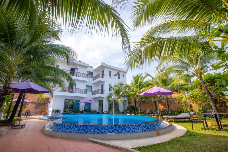 Lawn and parasols beside the pool