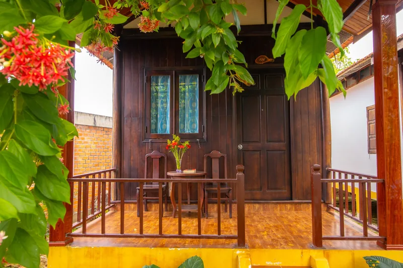 Bungalow front door framed by flowers