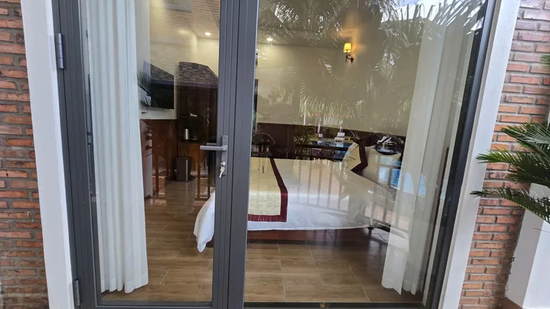 Sliding glass door between the room and the balcony