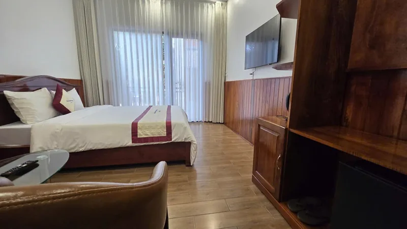 Premium room with a leather armchair and a glass table