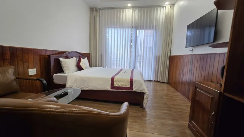 Double bed and full-height curtains in the new wing